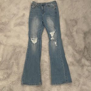 Ripped jeans with flare on bottom.